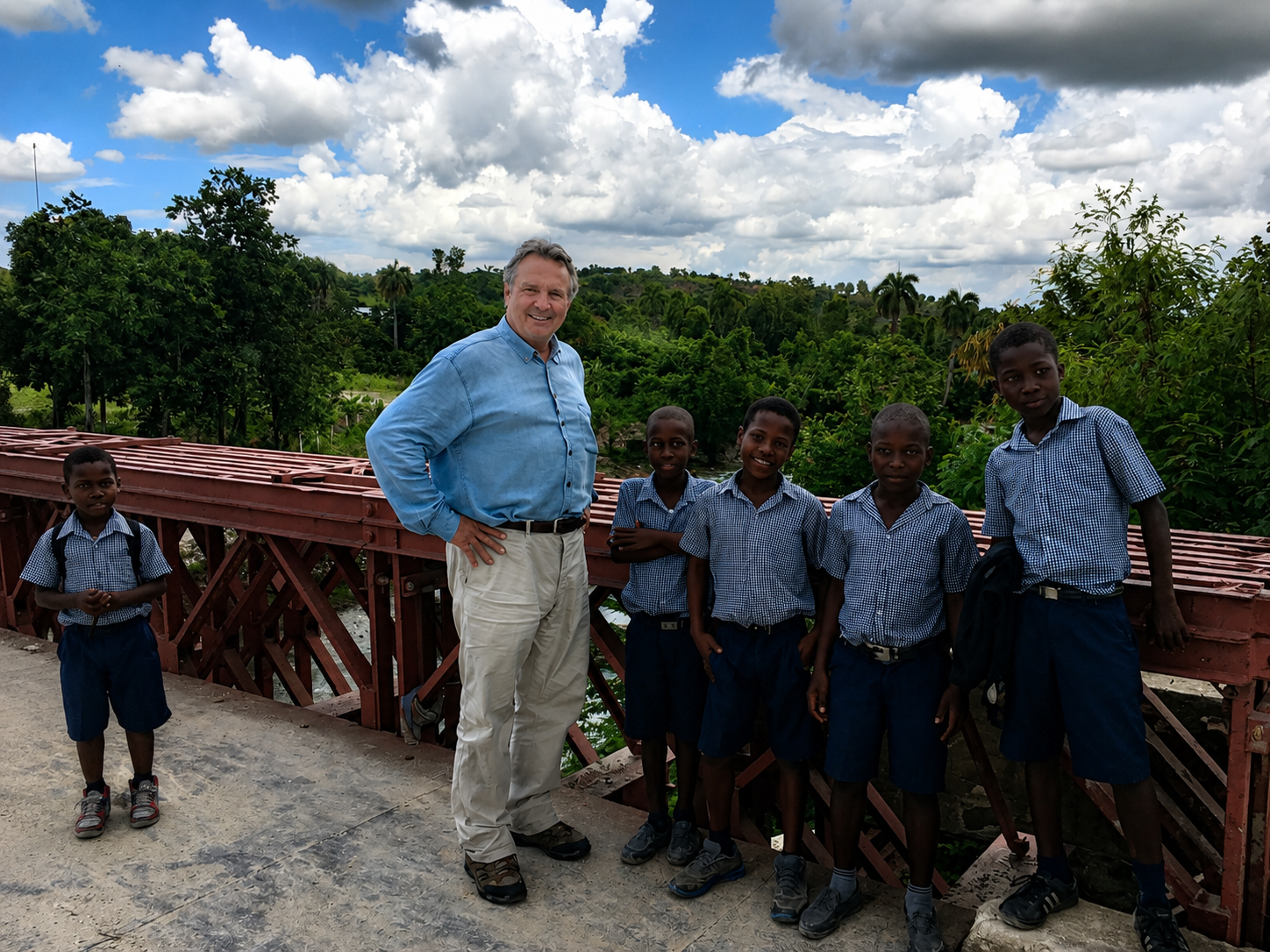 David with schoolchildren on a Cashman Family Foundation bridge in Haiti