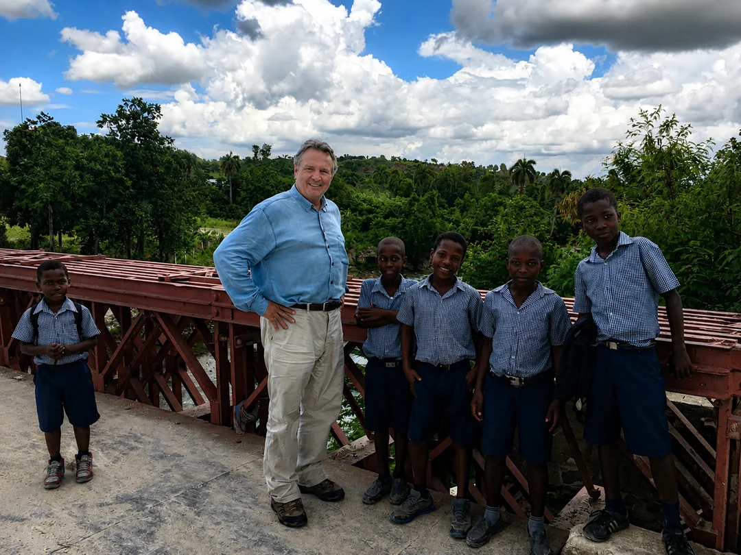 David with schoolchildren on a Cashman Family Foundation bridge in Haiti